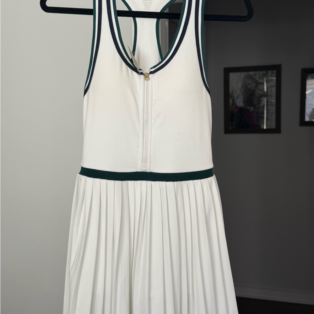 White Sleeveless athletic Dress with forest green and (I think) navy Trim